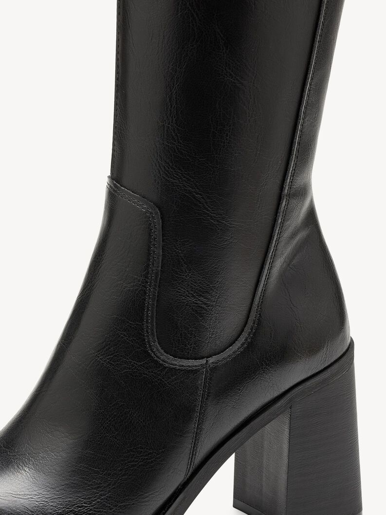 Detailed view of black leather women's boot with chunky heel